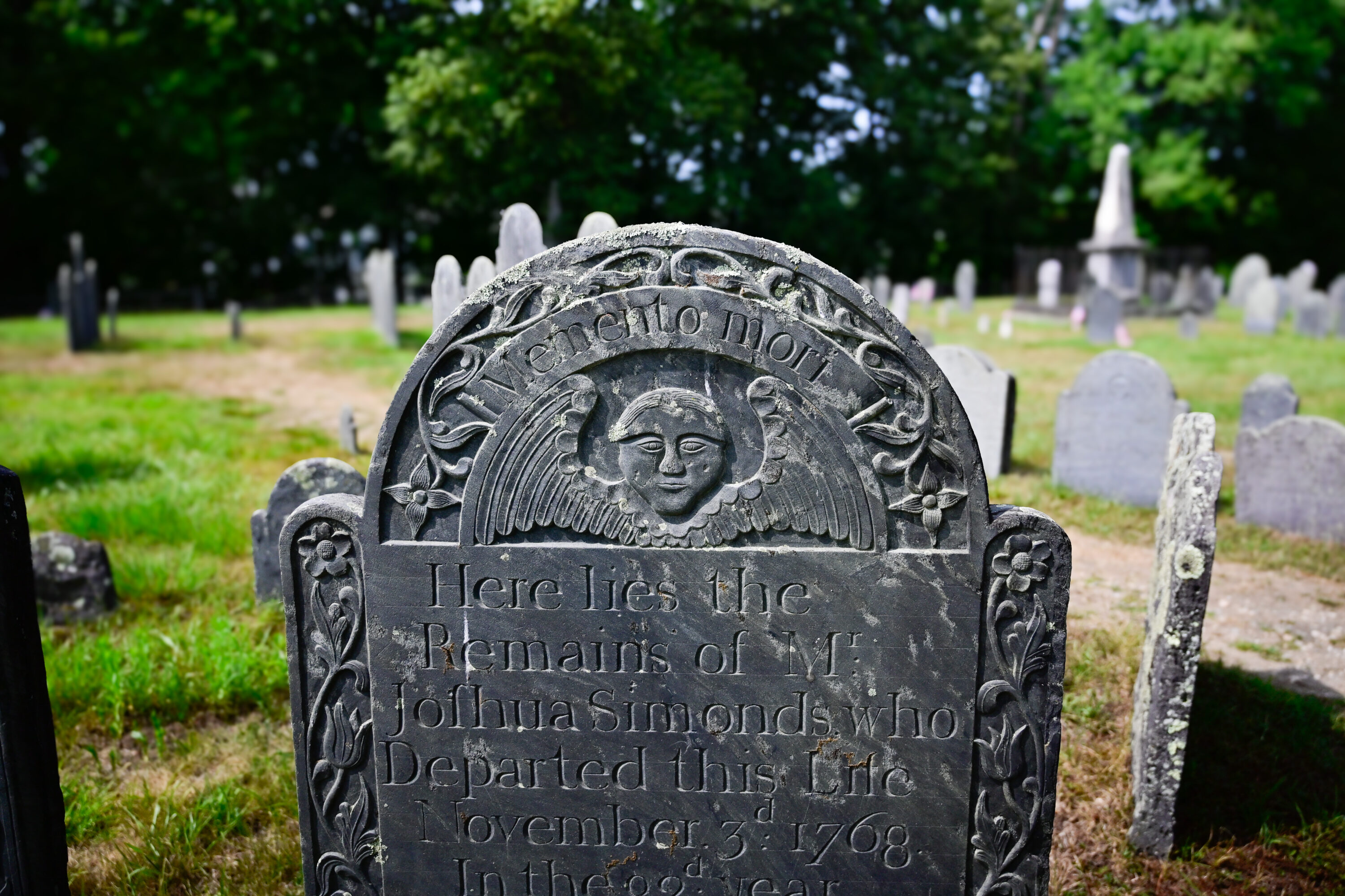 Grave stone with memento mori