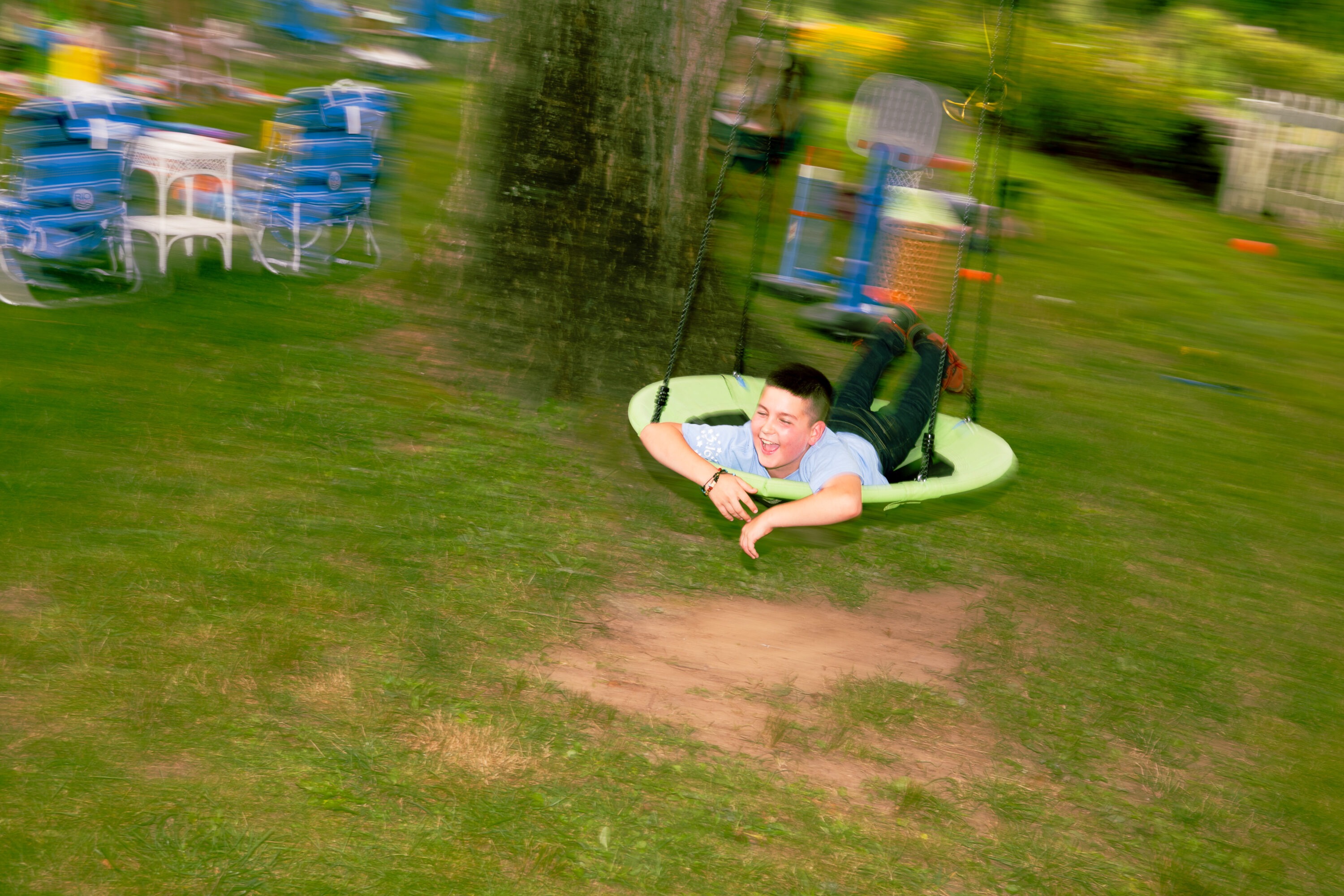 Boy playing on a swing